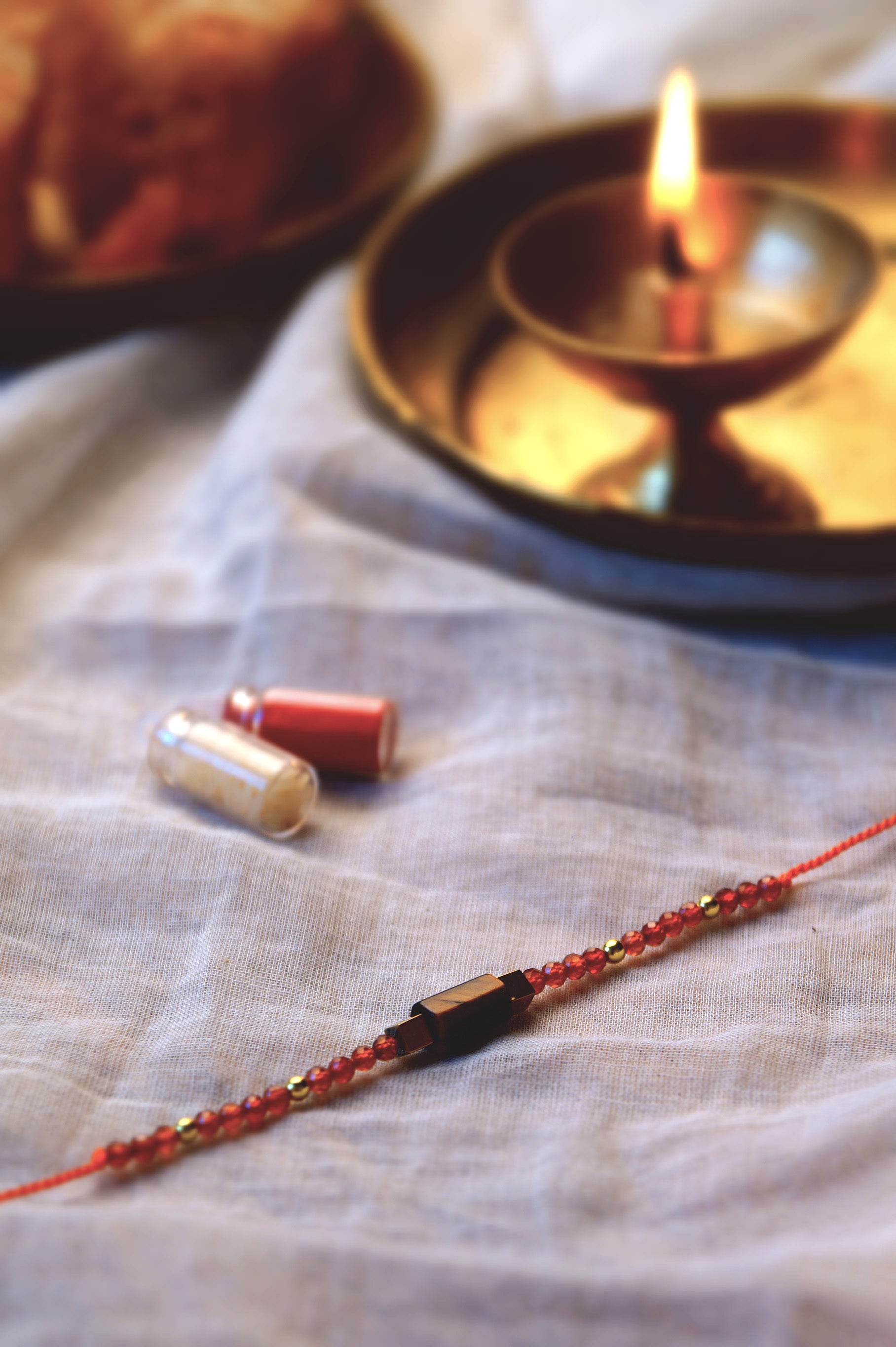 Tiger Eye & Red Onyx Crystal Rakhi